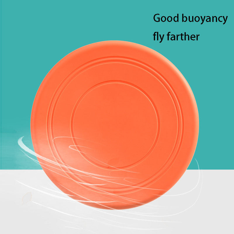 JMA Pet Goods orange silicone dog flying disc gliding through the air