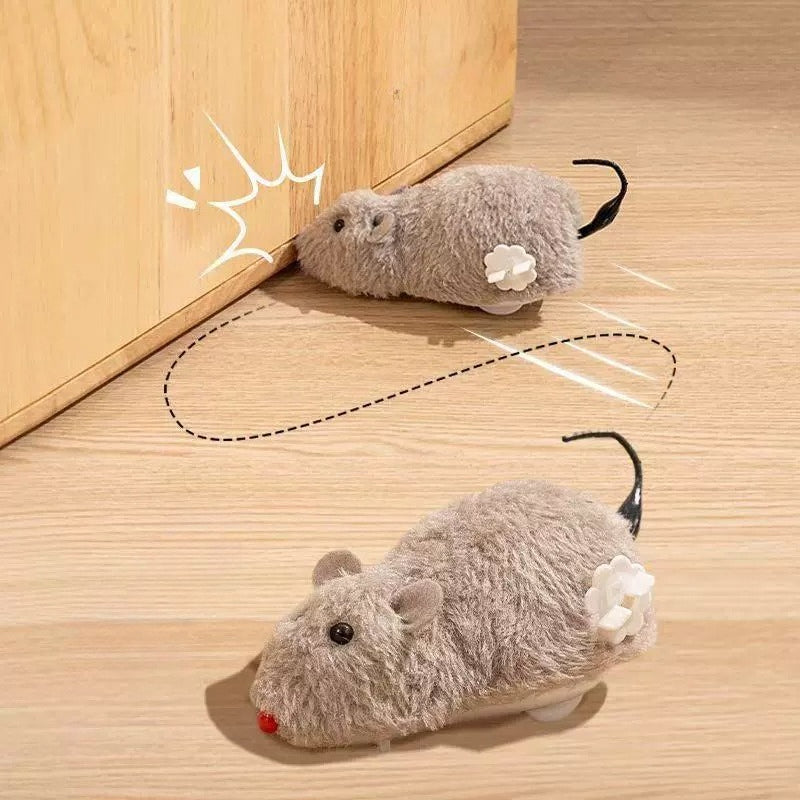 JMA Pet Goods wind-up mouse cat toys running across the floor and bumping into a cabinet